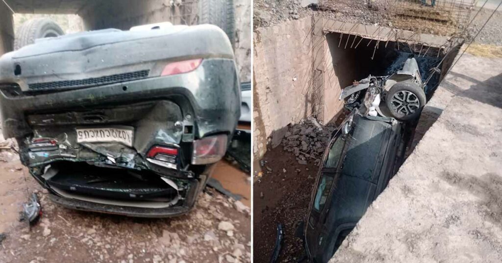 The jeep compass falls 20 feet below the road